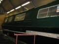 The coach-painted side of the boat starts to take shape